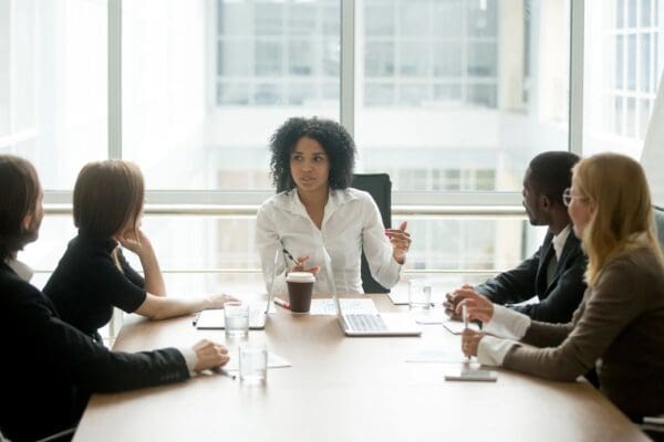 A group of people sitting at a table.