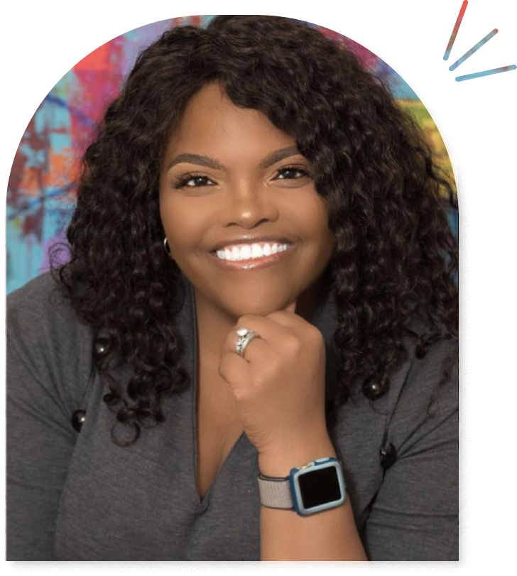 A woman with curly hair and a watch is smiling.